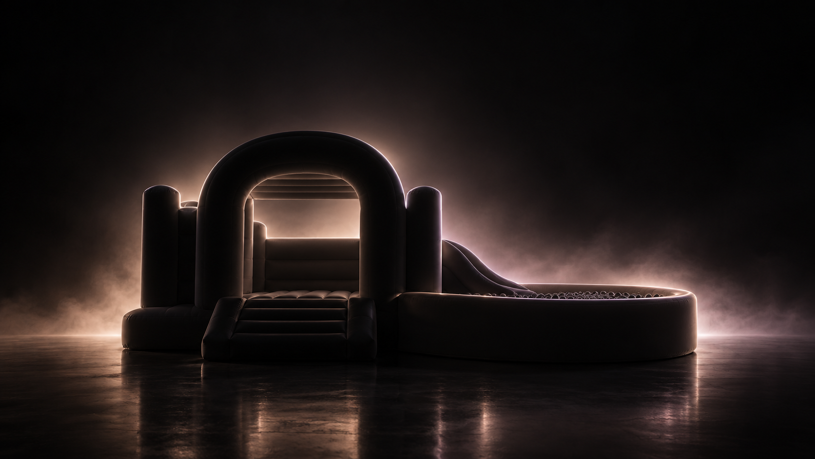 A softly illuminated silhouette of a modern soft-play and bounce-house setup